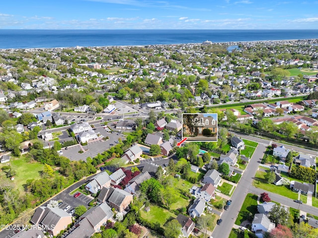 aerial view with a residential view and a water view