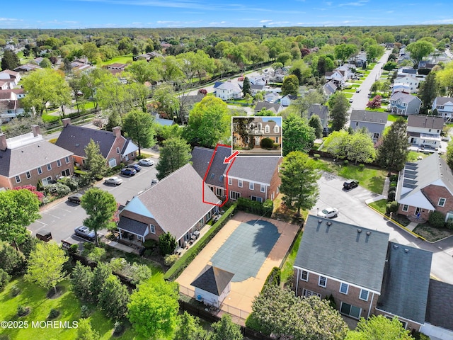 birds eye view of property with a residential view