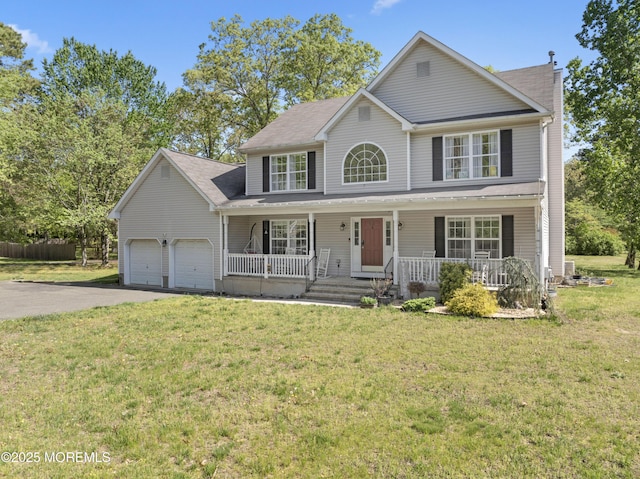 649 Toms River Rd, Jackson, NJ 08527 - traditional-style home with driveway, covered porch, a garage, and a front yard