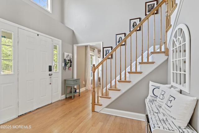 649 Toms River Rd, Jackson, NJ 08527 - entrance foyer featuring wood finished floors, stairway, a towering ceiling, and baseboards
