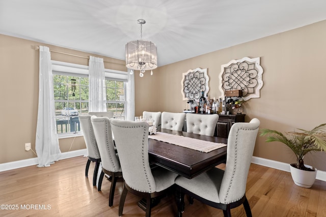649 Toms River Rd, Jackson, NJ 08527 - dining room featuring a chandelier, baseboards, and light wood-type flooring