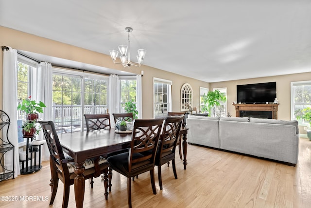 649 Toms River Rd, Jackson, NJ 08527 - dining room with a chandelier and light wood-style flooring
