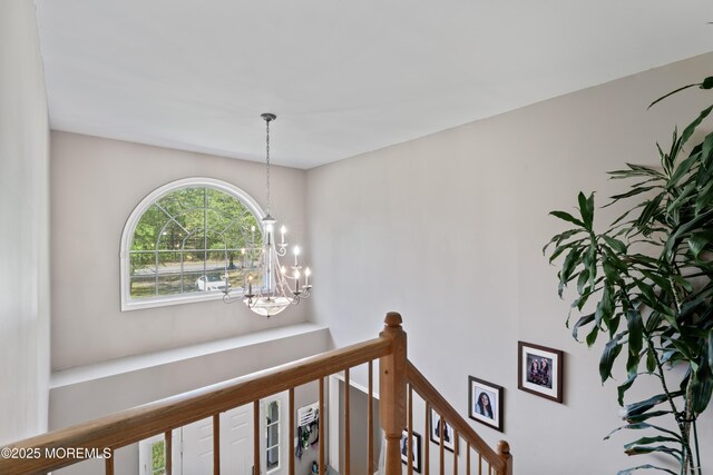 649 Toms River Rd, Jackson, NJ 08527 - corridor featuring an upstairs landing and a chandelier