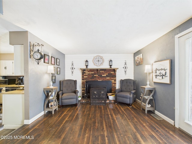 living area featuring wood finished floors and baseboards