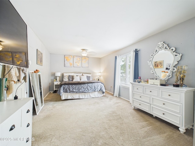 bedroom with light carpet, baseboards, and ceiling fan