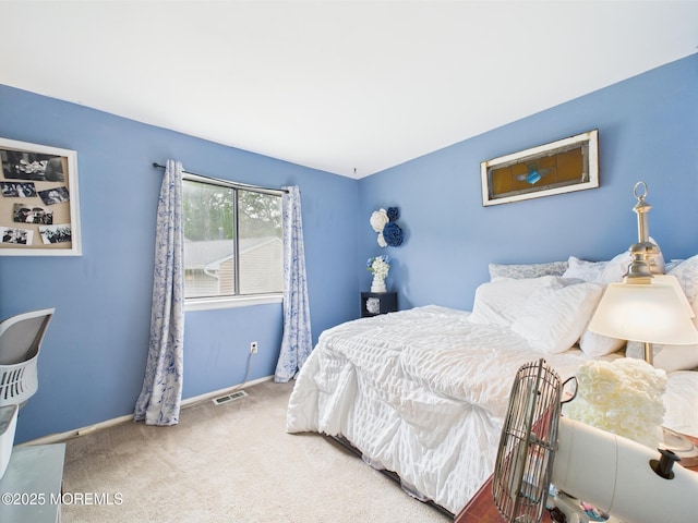 bedroom with carpet and baseboards