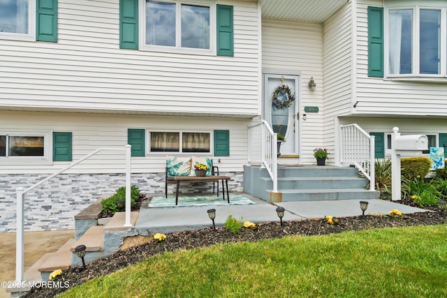 doorway to property with a patio area