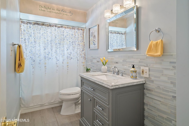 full bath with toilet and vanity