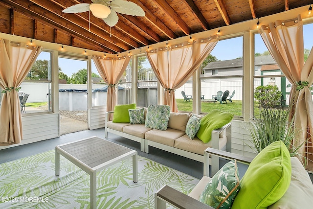 sunroom / solarium featuring a ceiling fan, a jacuzzi, an outdoor living space, vaulted ceiling, and a water view