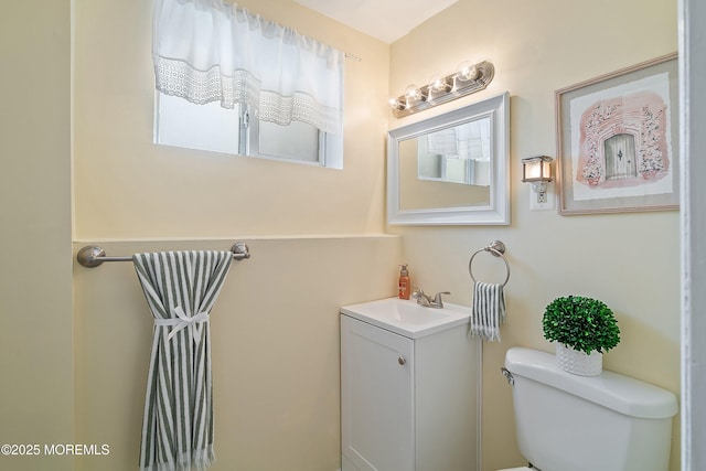 bathroom with toilet and vanity