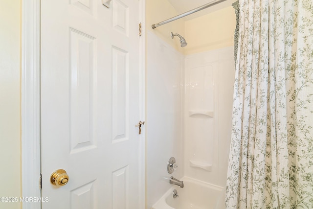 bathroom with shower / bathtub combination with curtain