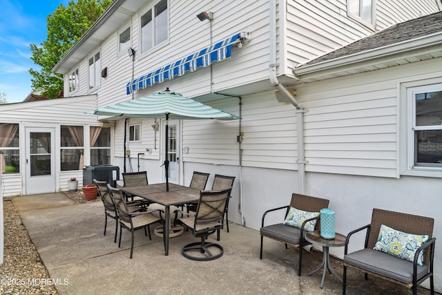view of patio with central air condition unit and outdoor dining space