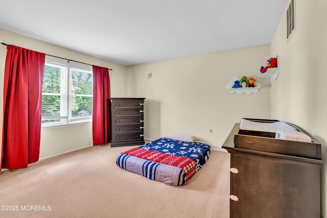 bedroom with carpet flooring and baseboards