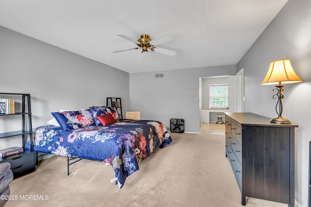 bedroom with light carpet and ceiling fan