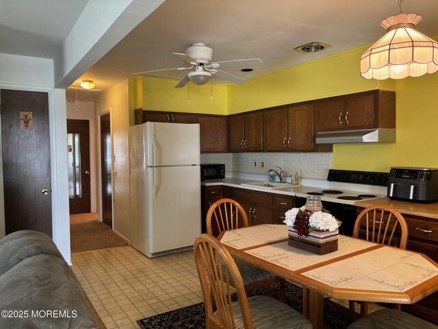 410 Highland Dr Unit A, Whiting, NJ 08759 - kitchen featuring black microwave, electric range oven, a sink, freestanding refrigerator, and under cabinet range hood