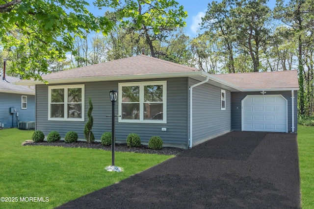 6 Reef Pl, Brick, NJ 08723 - view of front facade featuring a garage, asphalt driveway, and a front yard
