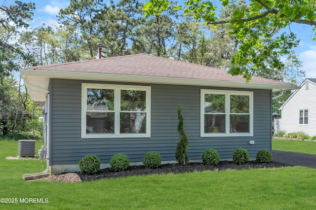 6 Reef Pl, Brick, NJ 08723 - view of side of home with central AC unit, a lawn, and roof with shingles