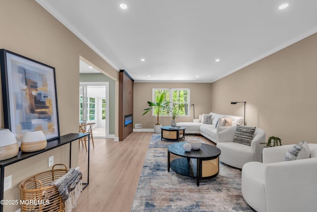 6 Reef Pl, Brick, NJ 08723 - living area with ornamental molding, light wood finished floors, recessed lighting, and baseboards