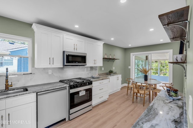 6 Reef Pl, Brick, NJ 08723 - kitchen featuring stainless steel appliances, a sink, white cabinets, recessed lighting, and tasteful backsplash