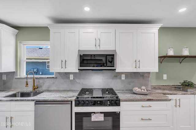 6 Reef Pl, Brick, NJ 08723 - kitchen featuring stainless steel appliances, a sink, white cabinets, open shelves, and backsplash