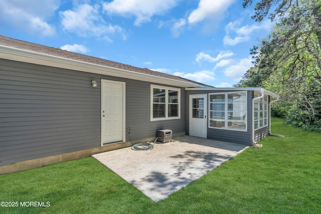 6 Reef Pl, Brick, NJ 08723 - rear view of property featuring a sunroom, a patio, and a lawn