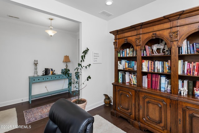 living area featuring baseboards and dark wood finished floors
