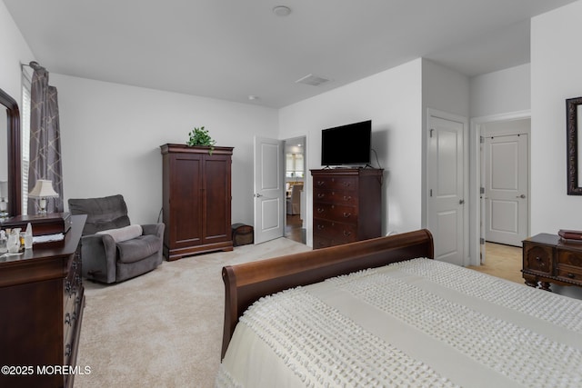 bedroom featuring light carpet