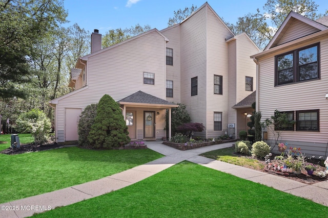 71 Verbena Ct, Jackson, NJ 08527 - view of front of home featuring a front lawn and a chimney