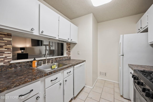 71 Verbena Ct, Jackson, NJ 08527 - kitchen featuring white dishwasher, dark countertops, a sink, white cabinetry, and visible vents