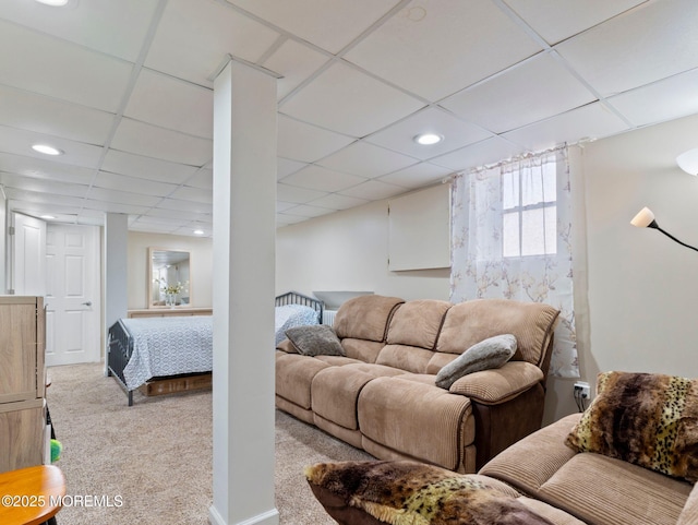 living room featuring carpet flooring, recessed lighting, and a drop ceiling
