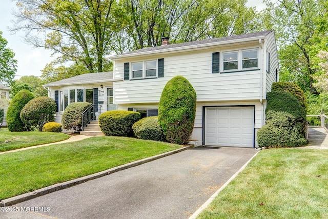 27 Hilltop Rd, West Long Branch, NJ 07764 - split level home featuring aphalt driveway, an attached garage, a front lawn, and a chimney