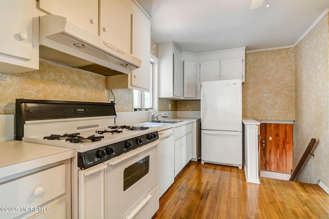 27 Hilltop Rd, West Long Branch, NJ 07764 - kitchen featuring light wood-style flooring, wallpapered walls, white appliances, under cabinet range hood, and light countertops