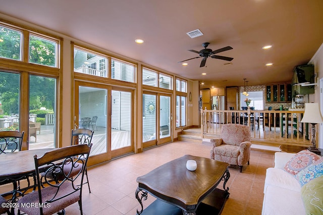 living room featuring recessed lighting, a ceiling fan, light tile patterned floors, and visible vents