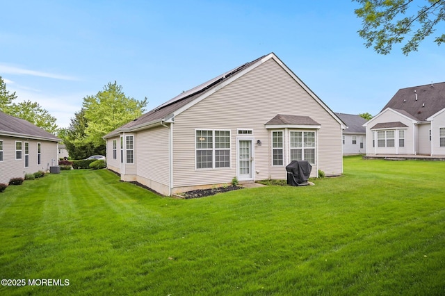 18 Hartack Rd, Manalapan, NJ 07726 - rear view of house with a lawn and central AC unit