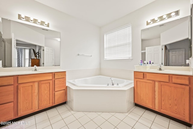 18 Hartack Rd, Manalapan, NJ 07726 - full bath with a garden tub, two vanities, and tile patterned floors