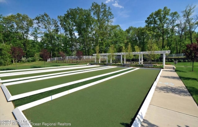 18 Hartack Rd, Manalapan, NJ 07726 - view of community featuring a game area and view of wooded area