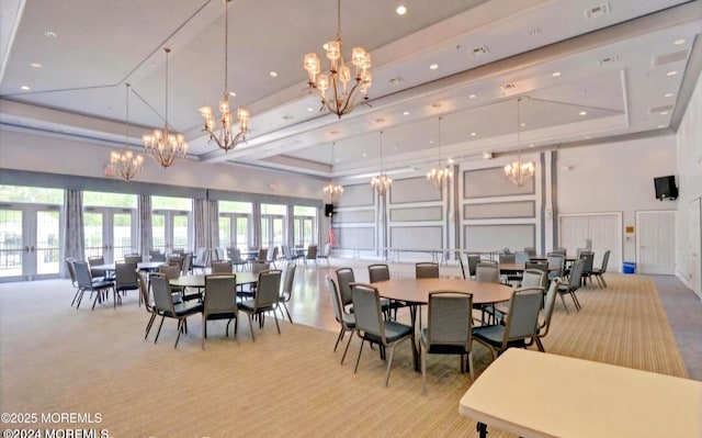 18 Hartack Rd, Manalapan, NJ 07726 - carpeted dining area featuring a decorative wall, a chandelier, a high ceiling, a tray ceiling, and recessed lighting