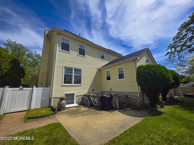 91 Grand Ave, Atlantic Highlands, NJ 07716 - rear view of house featuring a gate, fence, and a yard