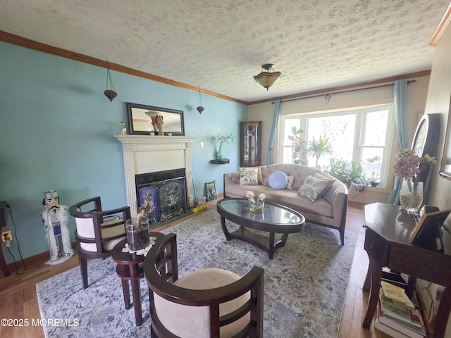 91 Grand Ave, Atlantic Highlands, NJ 07716 - living area featuring crown molding, wood finished floors, baseboards, a textured ceiling, and a fireplace with flush hearth