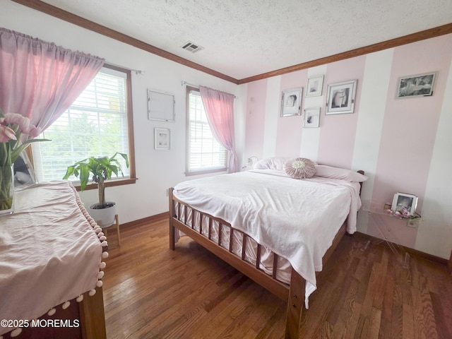 91 Grand Ave, Atlantic Highlands, NJ 07716 - bedroom featuring crown molding, a textured ceiling, baseboards, wood finished floors, and visible vents