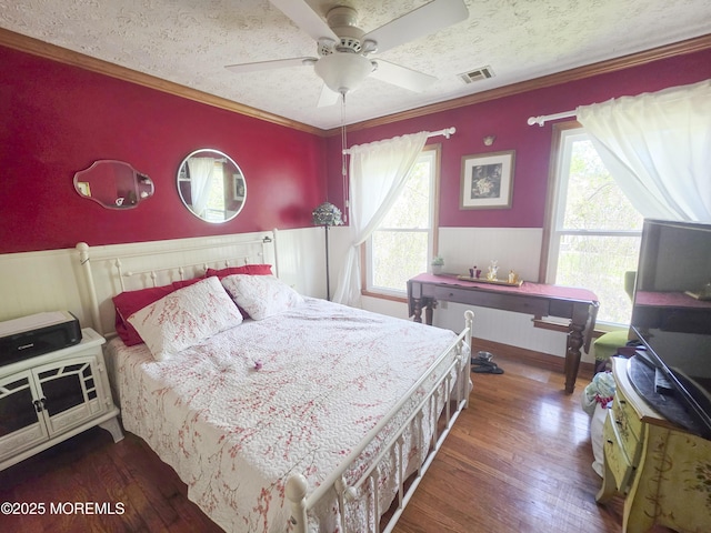 91 Grand Ave, Atlantic Highlands, NJ 07716 - bedroom featuring crown molding, visible vents, wainscoting, and wood finished floors