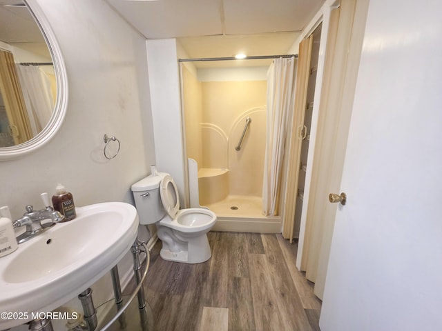 91 Grand Ave, Atlantic Highlands, NJ 07716 - bathroom with a sink, wood finished floors, toilet, and a shower stall