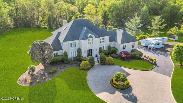 drone / aerial view featuring a view of trees