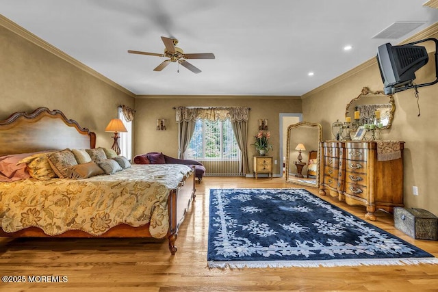 bedroom with crown molding, ceiling fan, recessed lighting, and wood finished floors