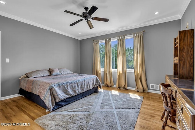 bedroom featuring light wood-style floors, crown molding, recessed lighting, and visible vents