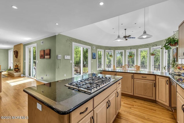 kitchen with recessed lighting, open floor plan, light wood-style flooring, and stainless steel gas stovetop