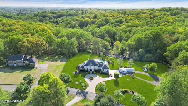 bird's eye view featuring a forest view