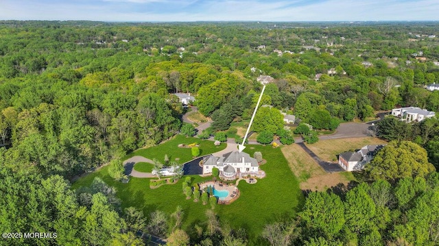 aerial view featuring a view of trees