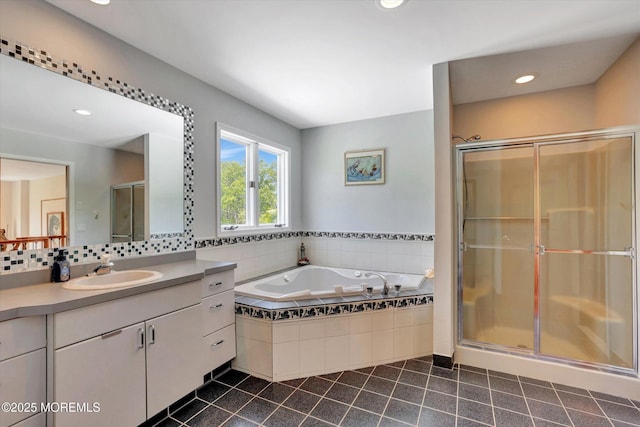 full bathroom featuring tile patterned floors, a shower stall, vanity, a bath, and recessed lighting