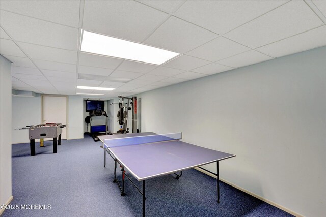 playroom featuring carpet floors and a drop ceiling